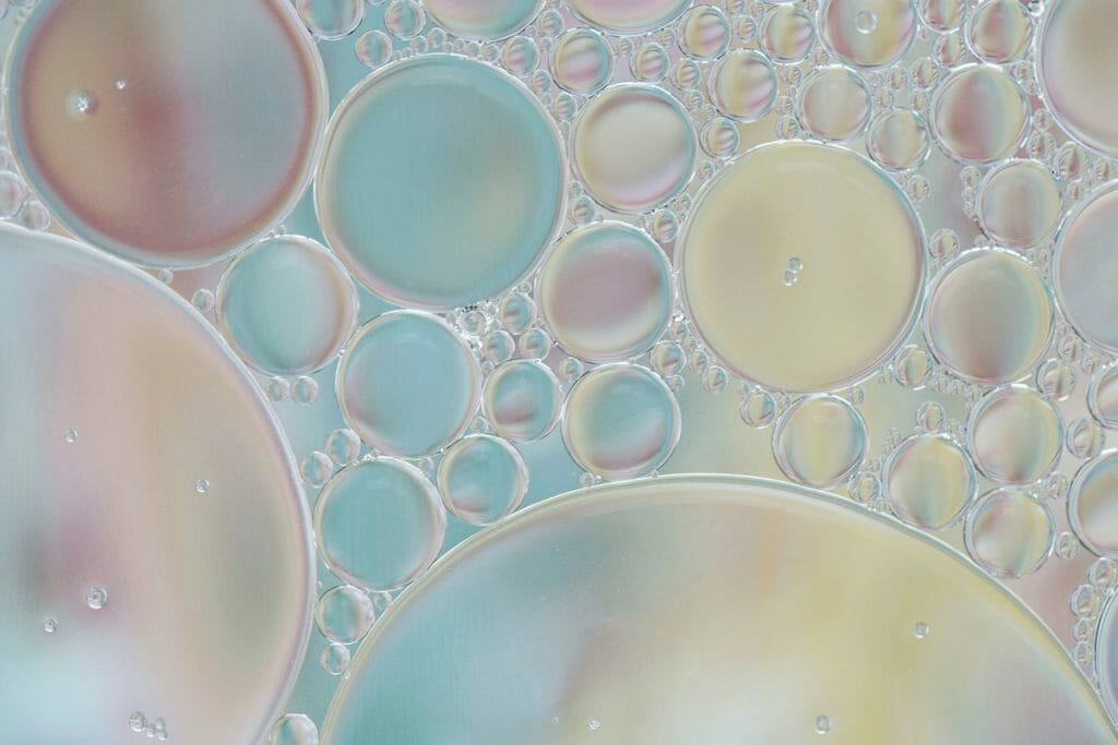 Closeup of multiple sizes of bubbles that depict water.
